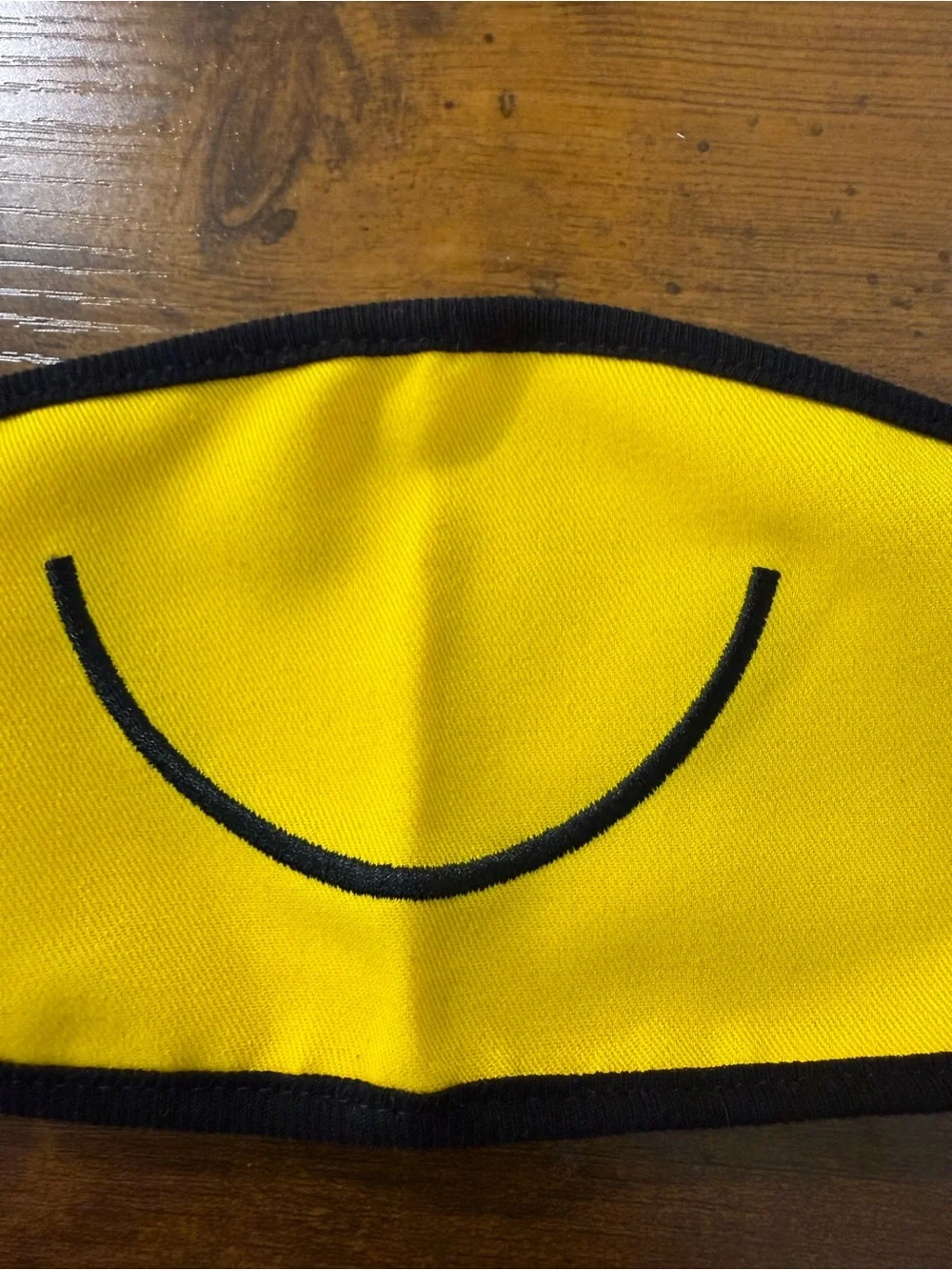 Yellow Smiley Face Mask with Black Trim